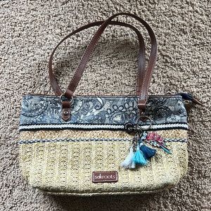 The Sakroots woven raffia purse